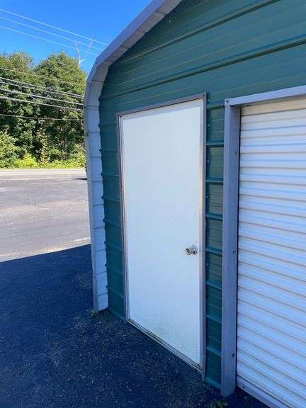 20x21 ft. Green metal Garage - w/ man door & garage door