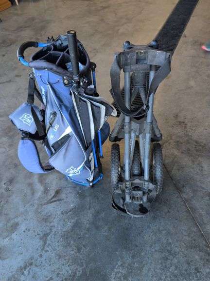 Wilson Staff golf bag and Sun Mountain bag carrier