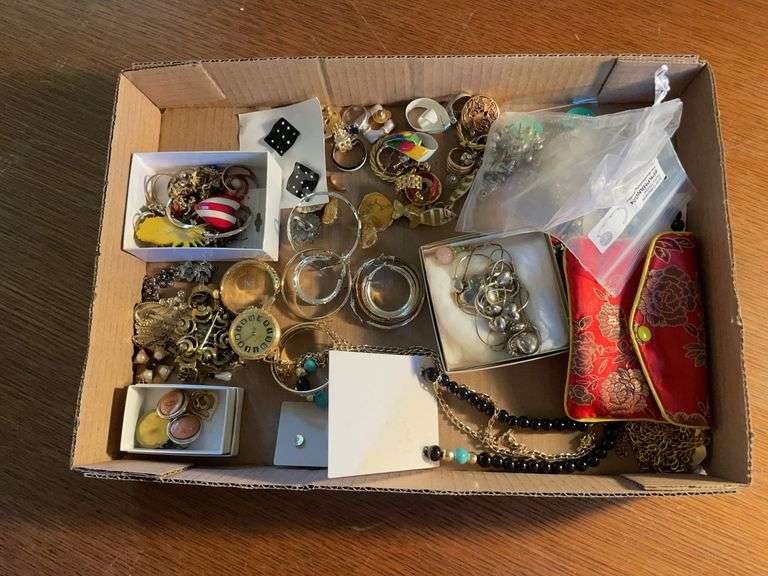 Flat of costume jewelry - earrings, necklaces, and more