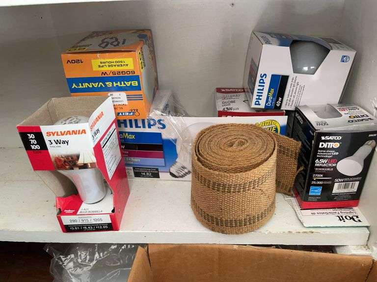 Contents of shelving including lightbulbs, screw-in hooks & more