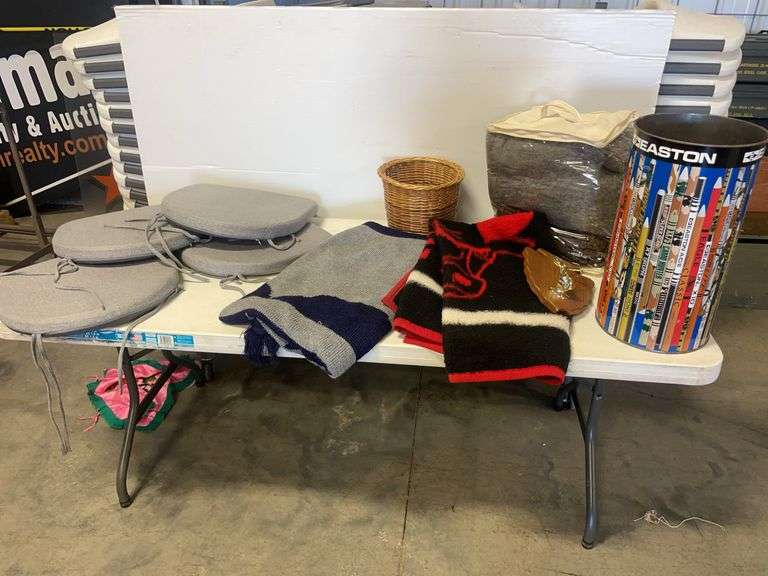 Blankets, seat cushions, Easton trash bin, and basket