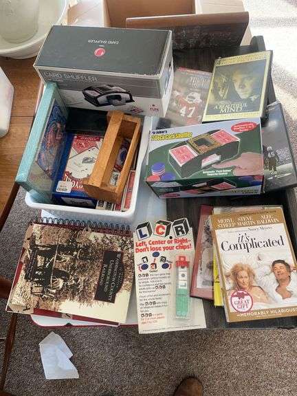 Lot of games & movies including card shuffler, playing cards, LCR & others