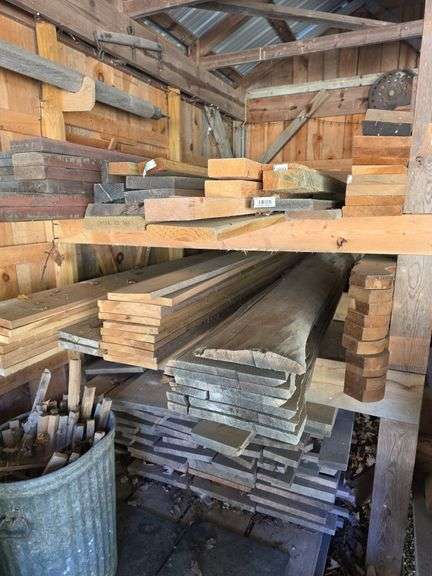 Assortment of stacked lumber. Under roof, lots of 8ft & 10ft variety of species Buyer responsible fo
