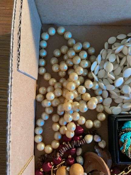 Flat of costume jewelry - mostly necklaces