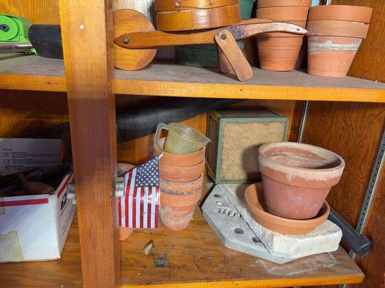 (3) shelves of gardening items including planters, sprinklers, small hose & more
