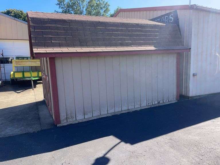 10x12 tan and red storage barn - contents not included