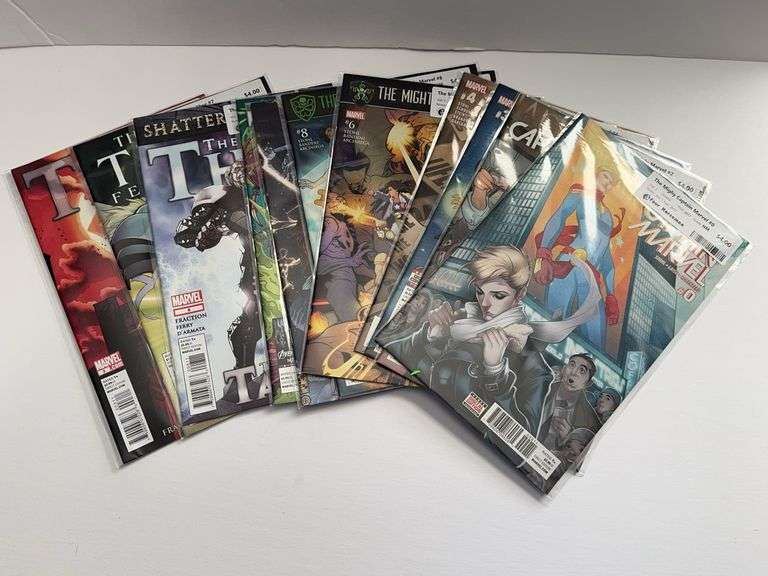 (7) Marvel The Might Captain Marvel and (5) The Might Thor Comics