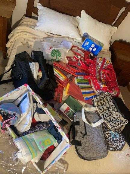 Large assortment of purses, tablecloths, and storage bags