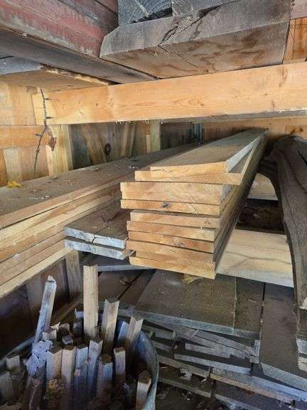 Assortment of stacked lumber. Under roof, lots of 8ft & 10ft variety of species Buyer responsible fo