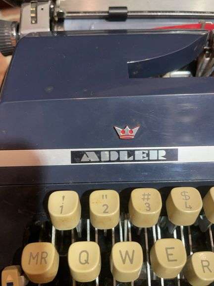 Antique Adler typewriter with case