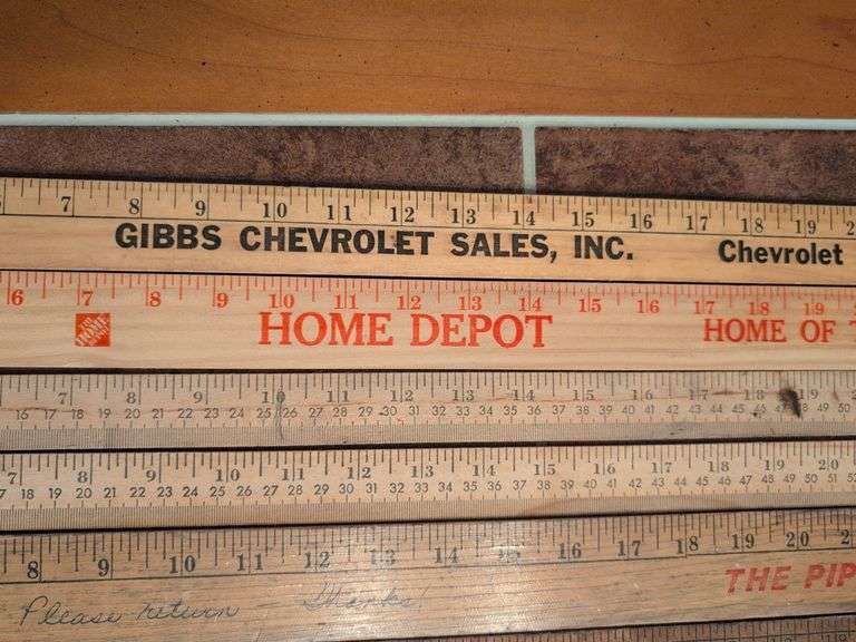 Advertisement yard sticks and (2) Dresden clocks