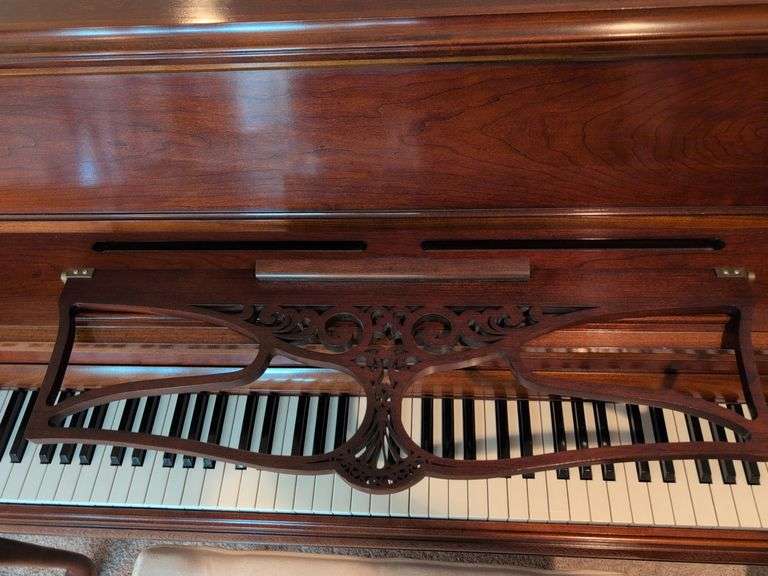 Young piano with bench seat