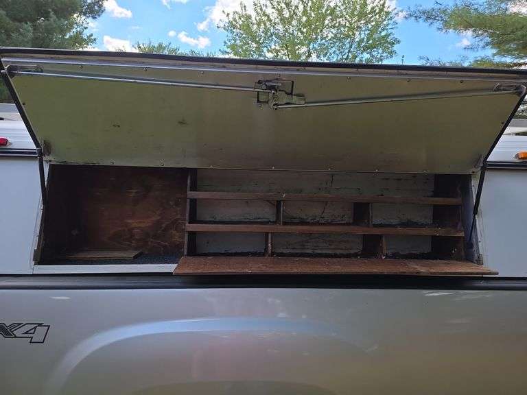 2012 GMC Sierra 1500 4x4 w/ toolbox cap. Runs good. Has a weak battery.