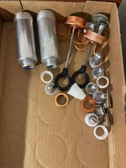(2) flats of antique cookie cutters and icing dispensers