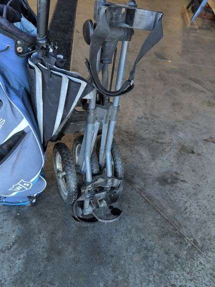 Wilson Staff golf bag and Sun Mountain bag carrier