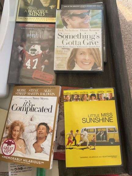 Lot of games & movies including card shuffler, playing cards, LCR & others