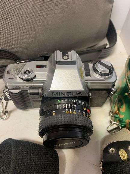 Suitcase, camera with bag, antique General Electric speaker, tin, and more