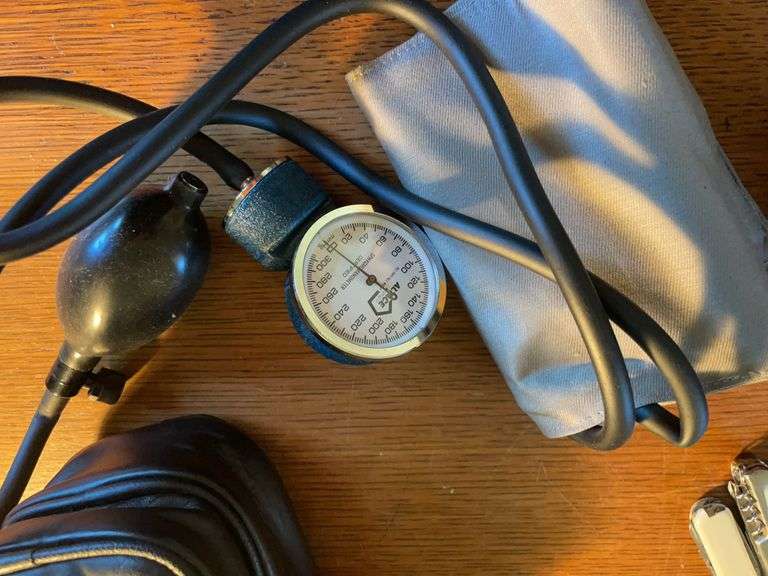 (2) Ambico cameras, blood pressure cuff, and (4) pocket knives