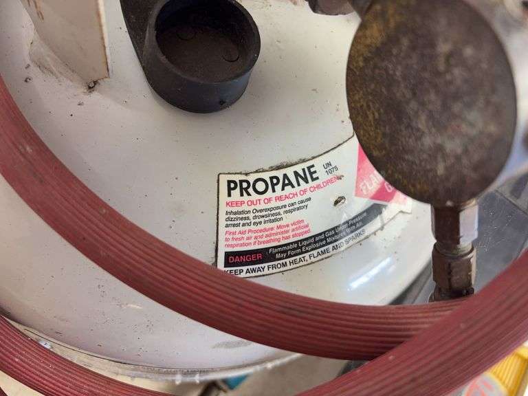 Propane tank with torch, deck sprayer, and level