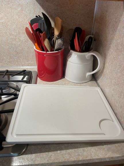 Cutting board and crock with miscellaneous kitchen utensils