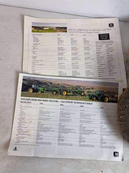 Miscellaneous John Deere items - (4) wheels, toy booklets, and more