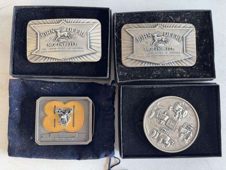(4) John Deere belt buckles