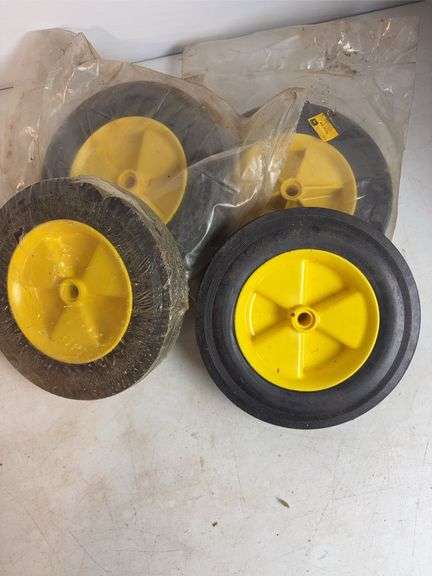 Miscellaneous John Deere items - (4) wheels, toy booklets, and more