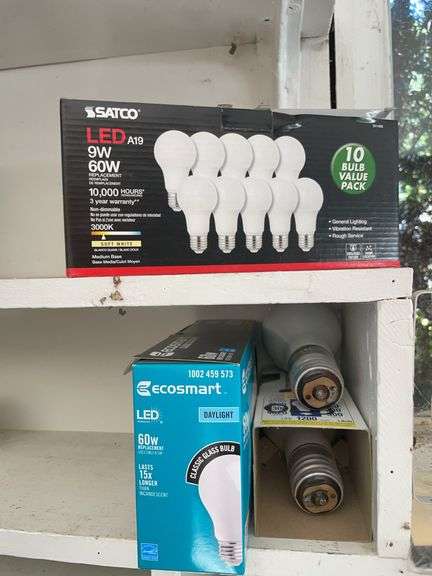 Contents of shelving including lightbulbs, screw-in hooks & more