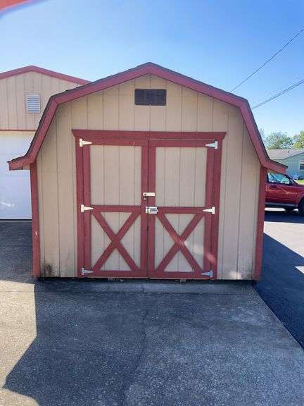 10x12 tan and red storage barn - contents not included
