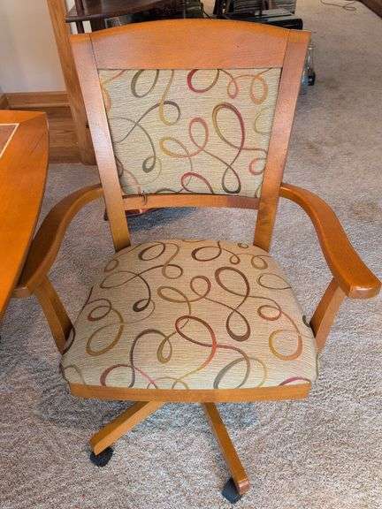 Matching dining table and (6) swivel chairs