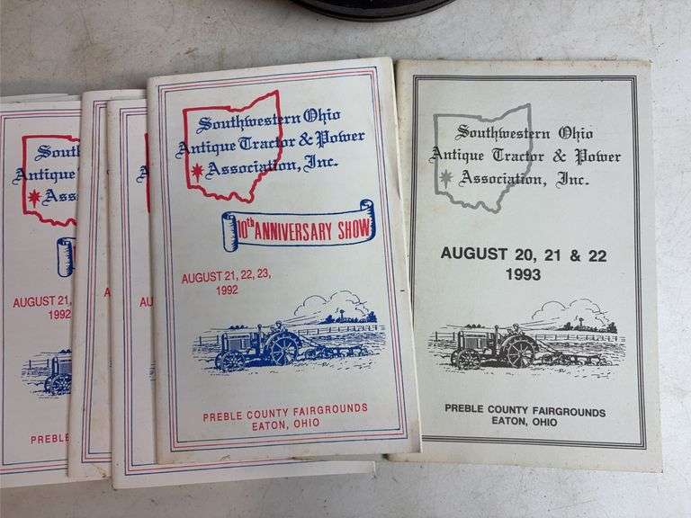 Miscellaneous John Deere items - (4) wheels, toy booklets, and more