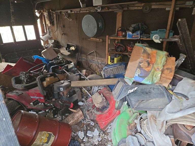 Contents of room- includes mower parts & misc