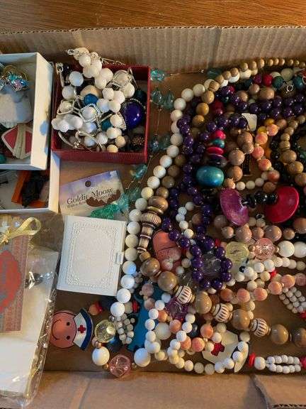 Flat of costume jewelry - mostly necklaces