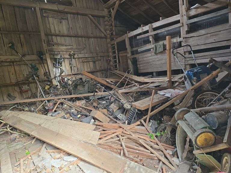 Contents of room- mower parts, weedeaters, misc