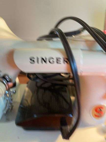 Singer sewing machine with attachments
