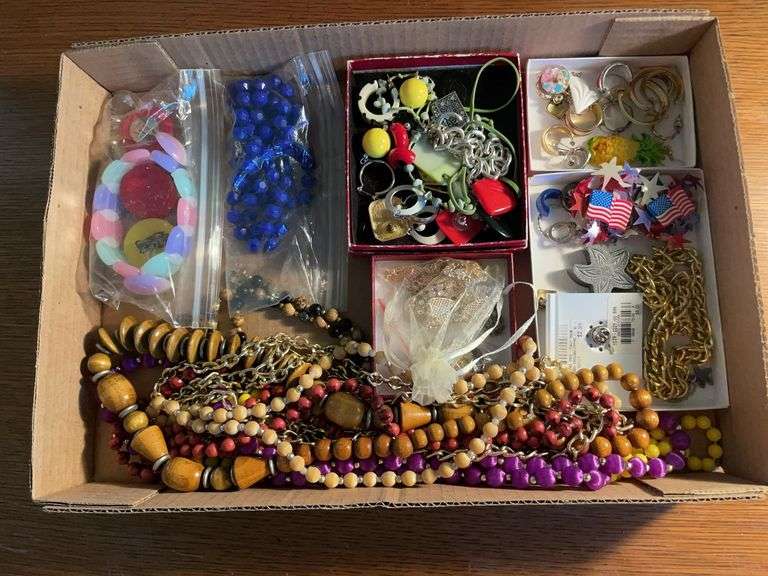 Flat of costume jewelry - mostly necklaces and earrings