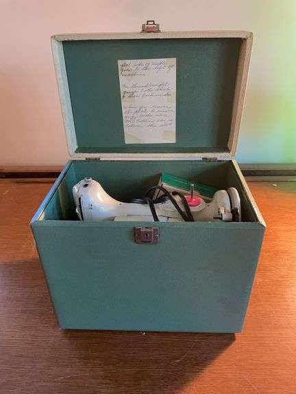 Singer sewing machine with attachments