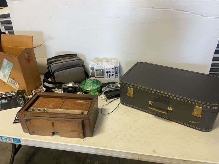 Suitcase, camera with bag, antique General Electric speaker, tin, and more