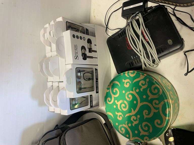 Suitcase, camera with bag, antique General Electric speaker, tin, and more