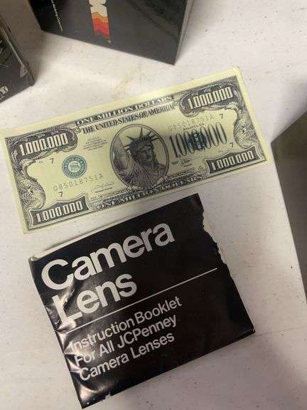 Suitcase, camera with bag, antique General Electric speaker, tin, and more