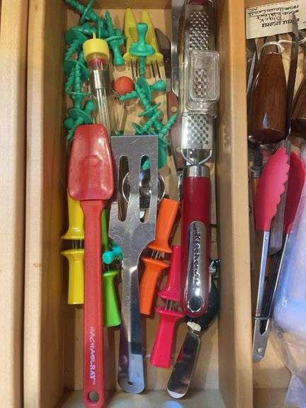 Contents of drawer including silverware, kitchen utensils & misc.