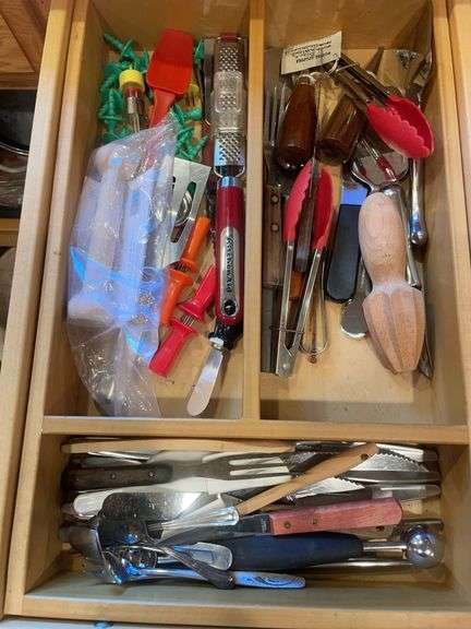 Contents of drawer including silverware, kitchen utensils & misc.