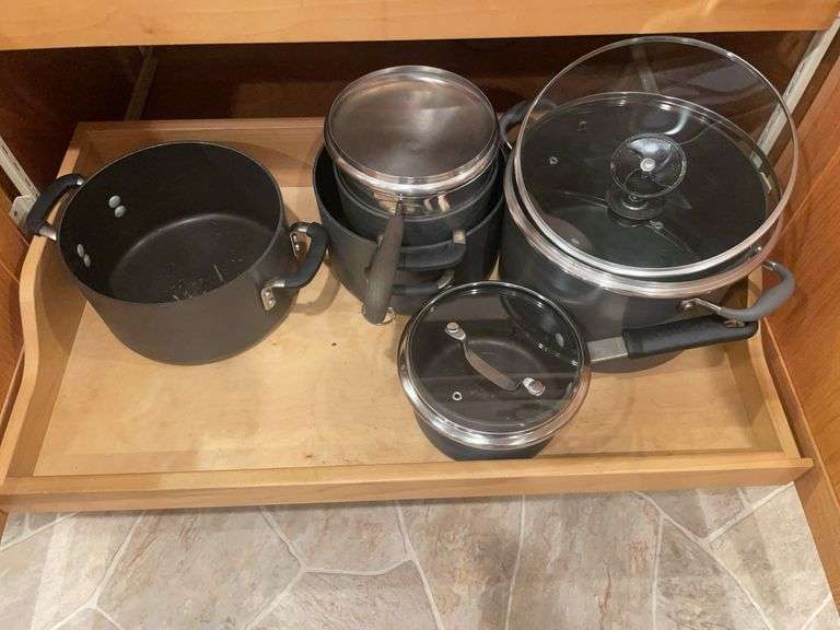 Kitchen drawer w/ mostly pots & lids
