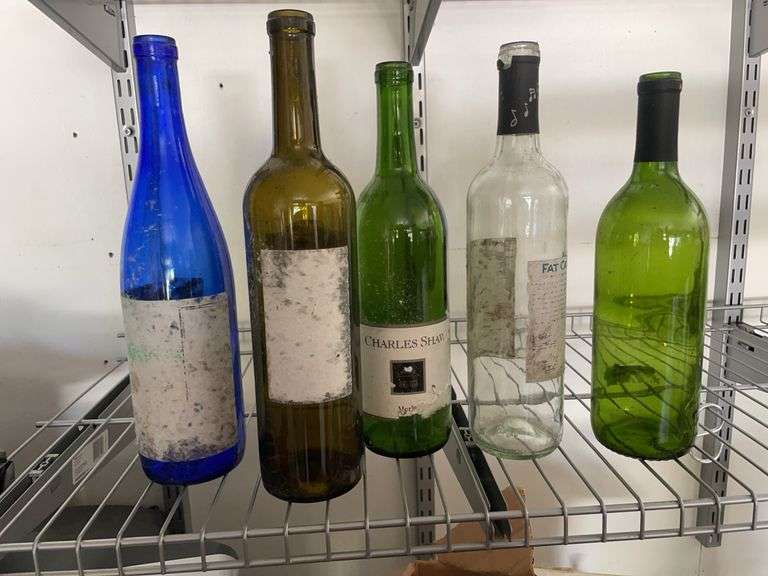 Box of empty wine bottles & decorative rack