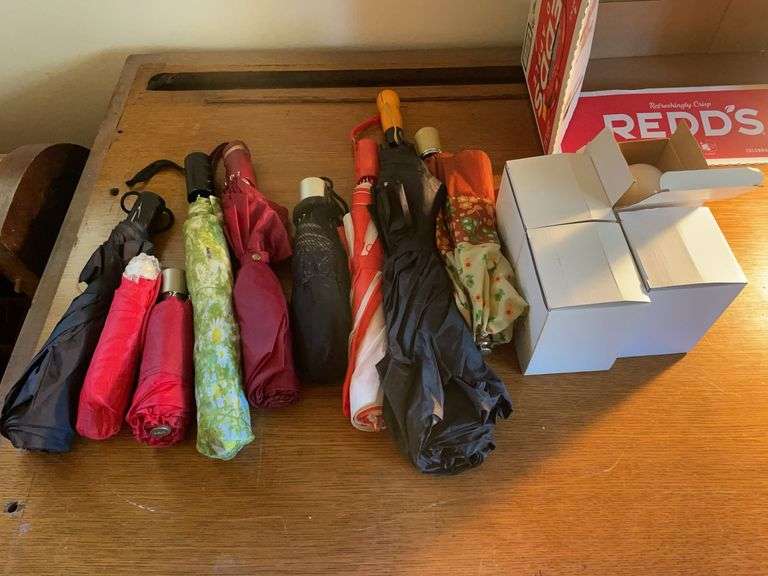 Assortment of umbrellas and (4) stick up light bulbs