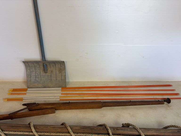 Yard markers, decorative shovel, branch trimmer, and antique piece