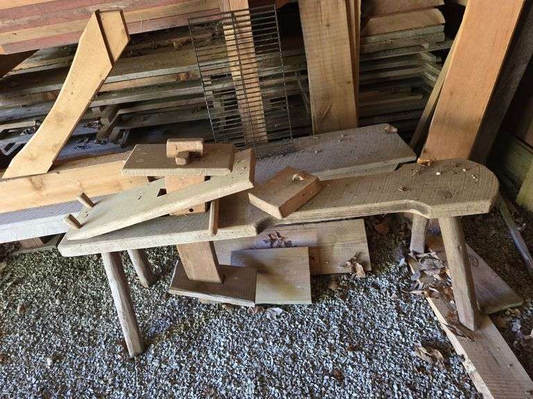 Assortment of stacked lumber. Under roof, lots of 8ft & 10ft variety of species Buyer responsible fo