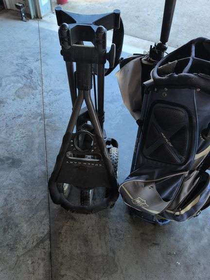 Wilson Staff golf bag and Sun Mountain bag carrier