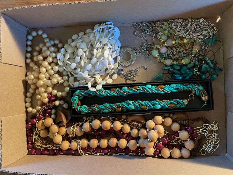 Flat of costume jewelry - mostly necklaces