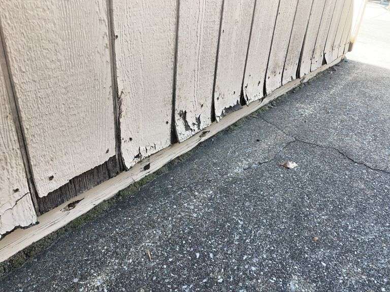 10x12 tan and red storage barn - contents not included